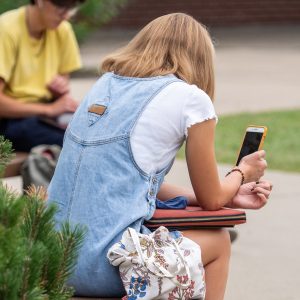 A student looking at her phone.