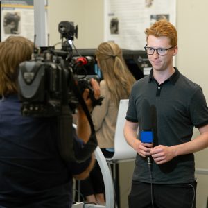 News crew interviewing a researcher.